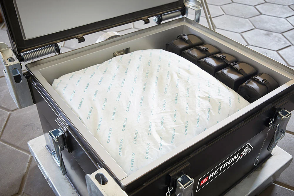 A large fire pillow labelled ‘Cirrux’ in a RETRON container.