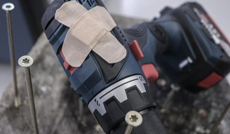 Cordless screwdriver that has been ‘repaired’ with plasters. Such devices can be a liability risk for commercial tenants.