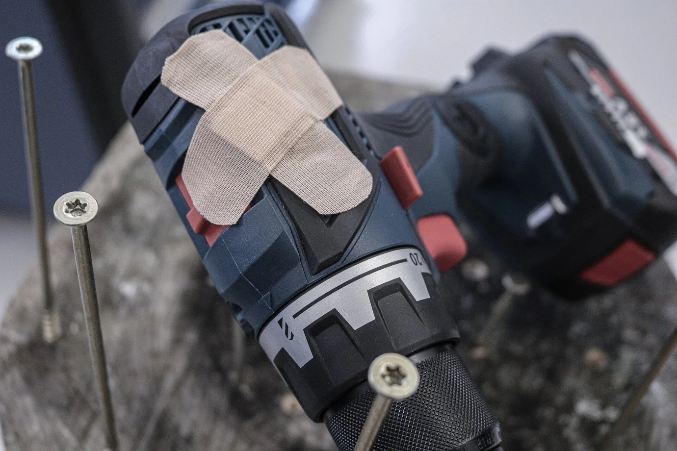 Cordless screwdriver that has been ‘repaired’ with plasters. Such devices can be a liability risk for commercial tenants.