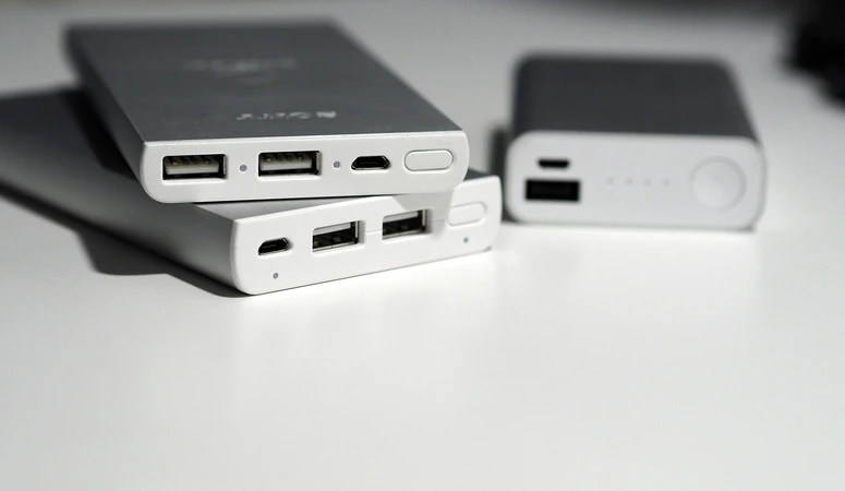 Three different old power banks are waiting to be disposed of.
