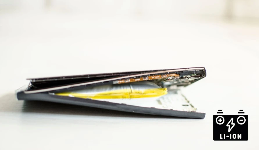 Opened smartphone with swollen battery. The lithium-ion battery can only be disposed of.