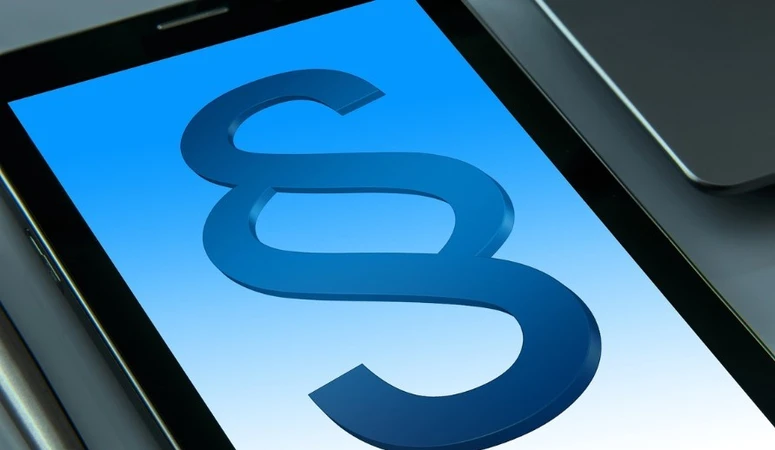 A paragraph sign on a battery-powered tablet as a symbol for the Battery Act.